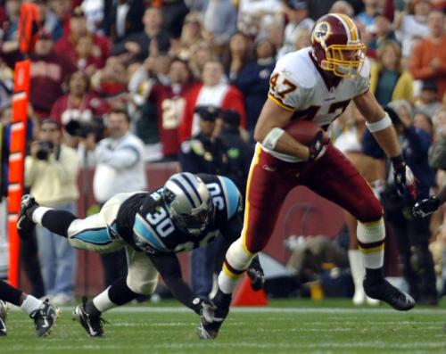 Chris Cooley runs for a 66 yard touchdown off of a pass from quarterback Jason Campbell against the Carolina Panthers during the fourth quarter on November 26, 2006 to take the lead and defeat the Carolina Panthers 17-13.